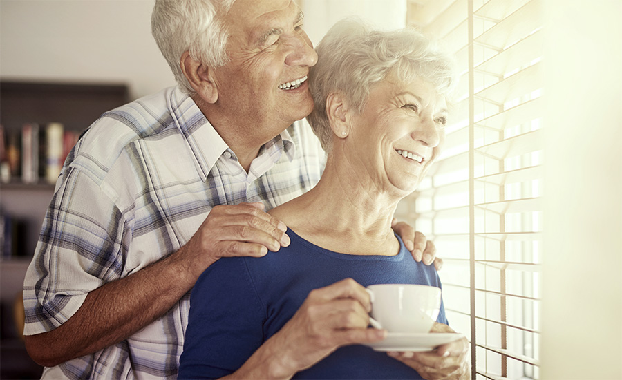 Senior couple next to the window