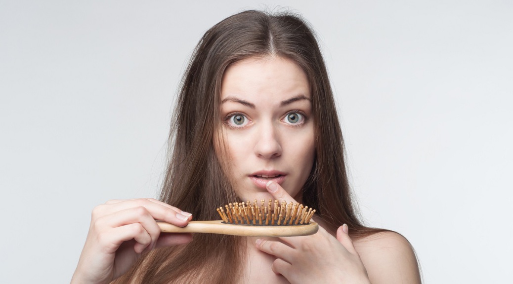 one young beautiful woman waves through hair loss